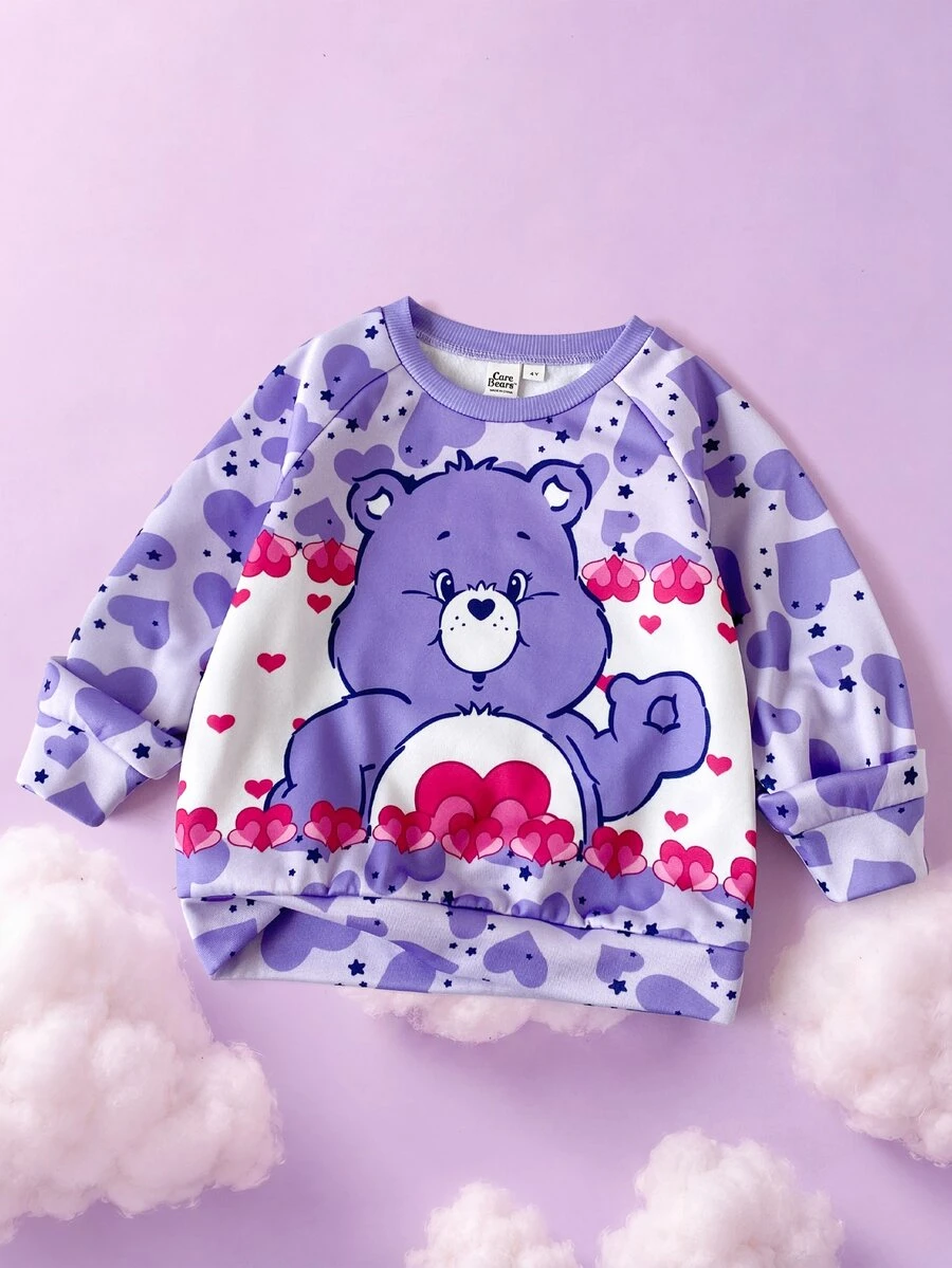 SHEIN X Care Bears 1件少女休閒百搭紫色可愛卡通愛心熊圖案圓領插肩袖寬鬆長袖套頭運動衫,適合日常穿著、秋冬、室內、運動、攝影、節慶、生日 - 紫色 - 查看 1