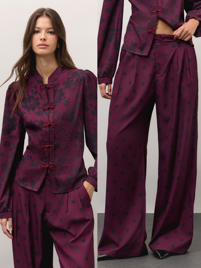 Nöista Burgundy Floral And Polka Dot Set With A High-Neck Blouse, Frog-Button Fastening And Puff Sleeves, Paired With Wide-Leg Trousers. A Cute Fall Style..