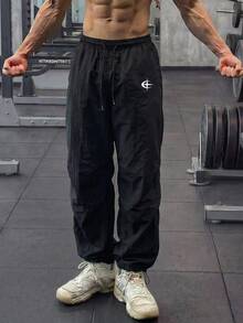 GymBeat Men's Graphic Print Drawstring Waist Loose Fit Sweatpants, Gym - Black - View 1