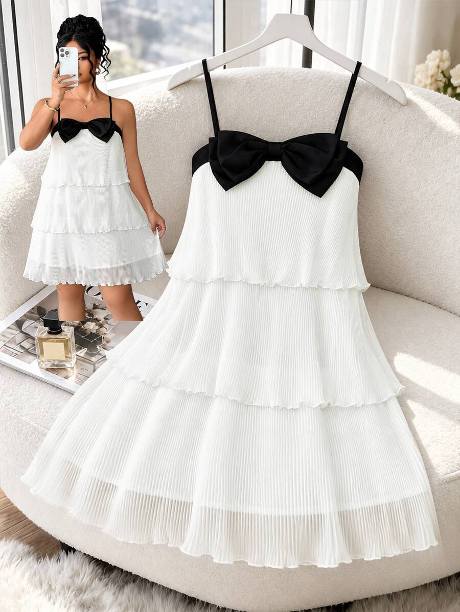 Rometta Plus Size Women's Spaghetti Strap Dress With Triple Layer Pleated Design And Prominent Black Bow On The Chest - White - View 1