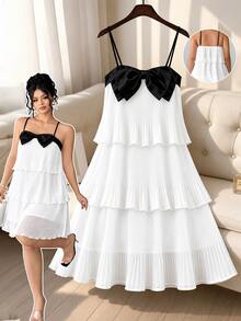Rometta Plus Size Women's Spaghetti Strap Dress With Triple Layer Pleated Design And Prominent Black Bow On The Chest - White - View 3
