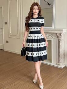 Feyla Women's Jacquard Colorblock Short Sleeve Waist-Cinching Knit Dress - Black and White - View 2