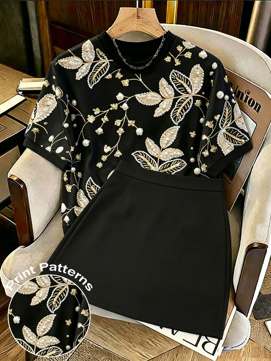 GlowEve CURVE [Printed Design] Plus Size Black And Gold Embroidery Pearl Decor Printed T-Shirt Short Sleeve Top And Mini Skirt Summer Elegant Date Night Casual Set, Vacation - Black - View 1
