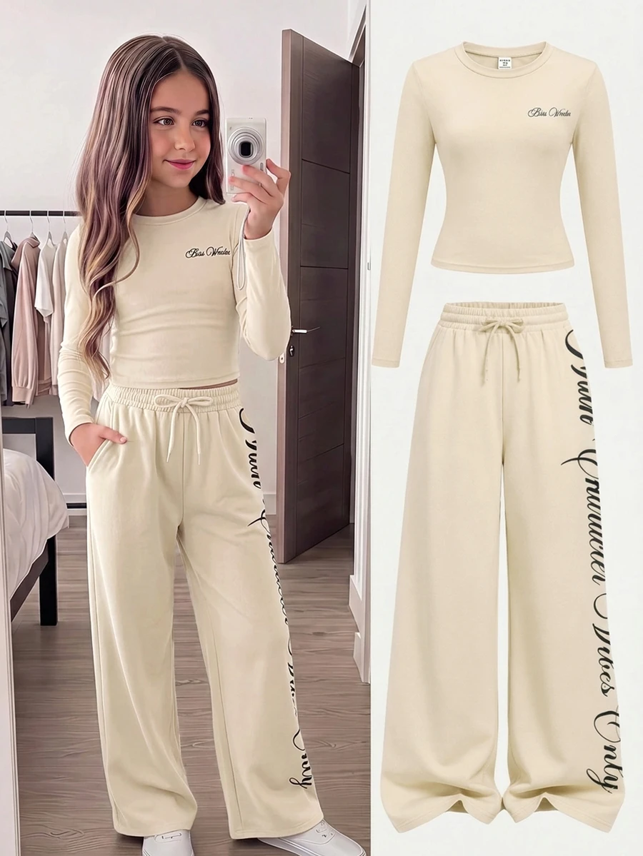 SHEIN طقم كاجوال من قطعتين للبنات المراهقات الصغيرات، تي شيرت بطبعة حروف وياقة دائرية وأكمام طويلة مع بنطال واسع الساق - لون مشمشي - مشاهدة 1