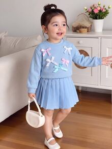 Genkimix Kids Young Girs 2pcs Autumn/Winter Light Blue Waffle Knit Sweater Top With Multi Colorful Ribbon Bowknot Accent And Pleated Skirt Set Cute Fall Clothing - Blue - View 1