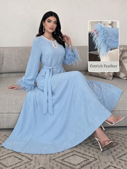 Yasmyna فستان نسائي أنيق وناعم وعصري متعدد الاستخدامات للربيع والخريف والشتاء، بتصميم ضيق للخصر ومؤثر تنحيفي، مزين بالخرز والشرابات وأكمام فرو