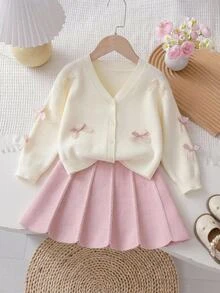 SHEIN 4-7歲女童米色V領針織開襟外套，飾有3D淺粉色蝴蝶結，長袖夾克搭配粉色麻花針織百褶裙2件套，溫柔甜美春/秋季幼兒針織套裝 - 粉色 - 查看 10
