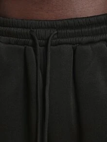 SUMWON Pantalon de jogging en molleton noir à jambes larges avec imprimé logo graffiti surdimensionné sur la jambe, motif étoile et design script crème usé - Noir - Voir 5
