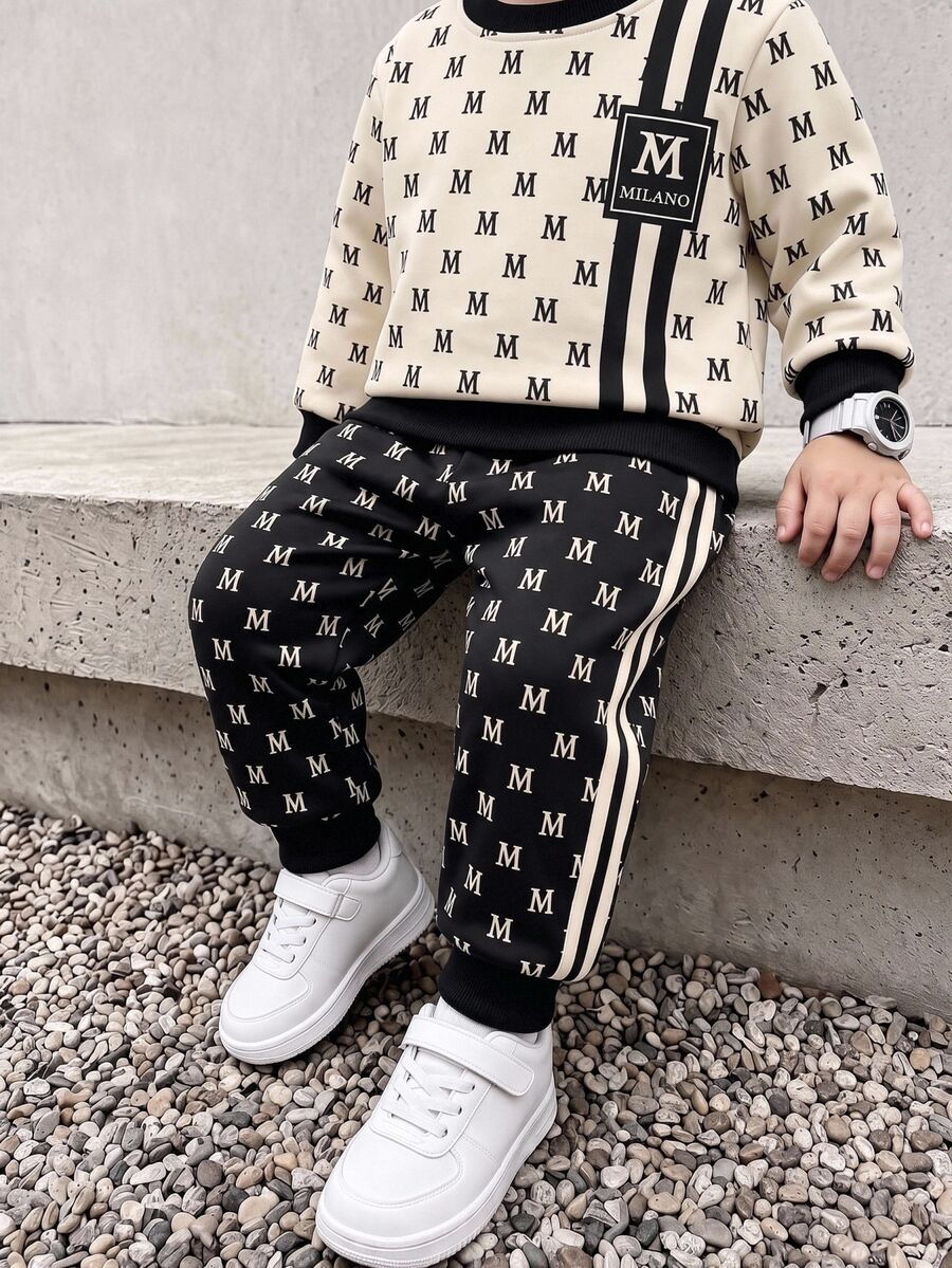 Young Boys Sweatshirt Set, Top With Beige Base Color, All-Over Black M Letter Print, Double Black Vertical Stripes Decoration On Sides, Square M Logo, Black Ribbed Collar And Cuffs, Matching Long Pants With Black Base Color, All-Over M Letter Print, Double White Stripes On Sides, Ribbed Cuffs - Multicolor - View 1