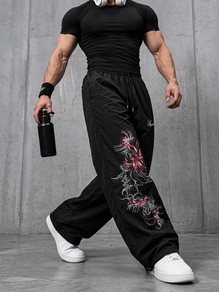 GymRaken بنطال رياضي طويل للرجال بطبعة زهور وخصر برباط، للجيم - الأسود - مشاهدة 1