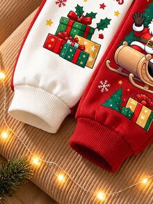 小男孩運動衫套裝，紅白色上衣印有聖誕老人坐雪橇圖案與「Merry Christmas」文字，雪花與星星裝飾，搭配紅白拼接長褲，同款聖誕印花，羅紋袖口與下擺 - 彩色 - 查看 6
