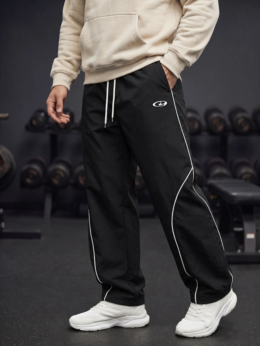GymBeat Men's Lightweight Woven Sports Pants,Stylish Letter Design Drawstring Waist Baggy Workout Gym Clothes,Athletic Track Sweatpants For Outdoor Training - Black - View 1