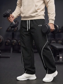 GymBeat Men's Lightweight Woven Sports Pants,Stylish Letter Design Drawstring Waist Baggy Workout Gym Clothes,Athletic Track Sweatpants For Outdoor Training - Black - View 5
