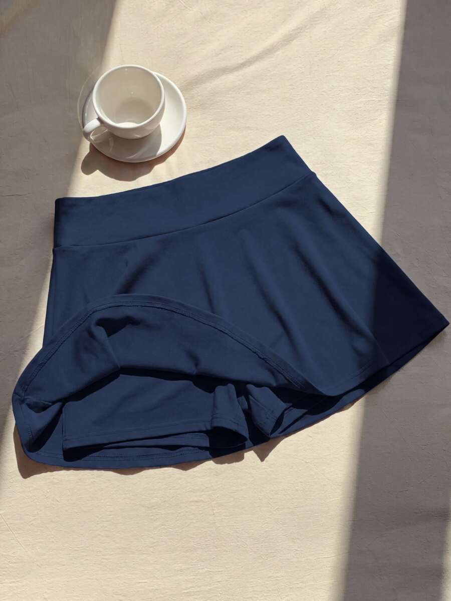 Rok celana pendek (skort) warna polos serbaguna untuk remaja putri, cocok untuk musim gugur, cocok untuk tenis, lari, olahraga, kasual, dan gaya preppy, serta untuk liburan, prom, dan acara formal berwarna biru.