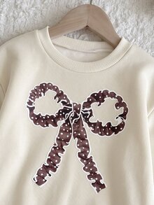 SHEIN 女嬰 3D 蝴蝶結波點印花圓領套頭褶皺荷葉邊拼接秋季洋裝，抓絨內裡加厚款，適合冬季 - 杏色 - 查看 3
