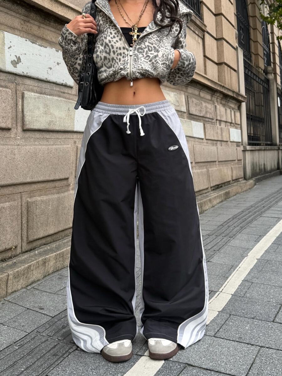 Coolane 男女款秋冬街頭風運動休閒日常外出沙灘運動褲 拼色條紋紋理 寬鬆低腰 黑色 - 彩色 - 查看 1