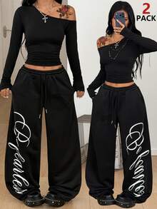 Coolane Conjunto de dos piezas para mujer talla grande, camiseta de cuello asimétrico y pantalones de chándal de pierna ancha, color negro, elegante para uso diario, salidas y deportes, otoño e invierno - Negro - Ver 1