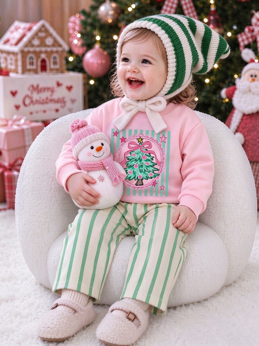 SHEIN Playful Pals 嬰兒女童 T-shirt 套裝,正面印有精緻蝴蝶結與聖誕樹圖案,綠色直條紋背景配粉色星星裝飾,羅紋領口與袖口,下身為米白色底綠色直條紋長褲 - 彩色 - 查看 1