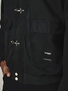 SUMWON Solid Bomber Jacket With Silver Clip Buckle Closure Point Collar Patch Pockets And Ribbed Hem Streetwear Outerwear - Black - View 2