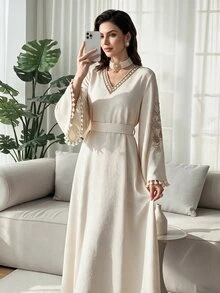 Al Najma Women's Arabian Traditional Long Dress With Floral Embroidery, Fringed Cuffs And Bell Sleeves Modest Kaftan - Apricot - View 1