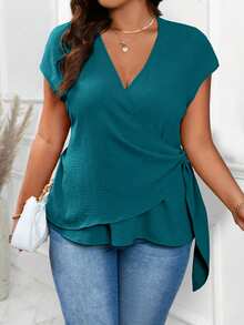 Rometta Plus Size Peacock Blue Deep V-Neck Ruched Textured Fabric Cross Wrap Side Tie Short Sleeve Asymmetrical Hem Cinched Waist Casual Commuter Versatile Blouse - Blue - View 3
