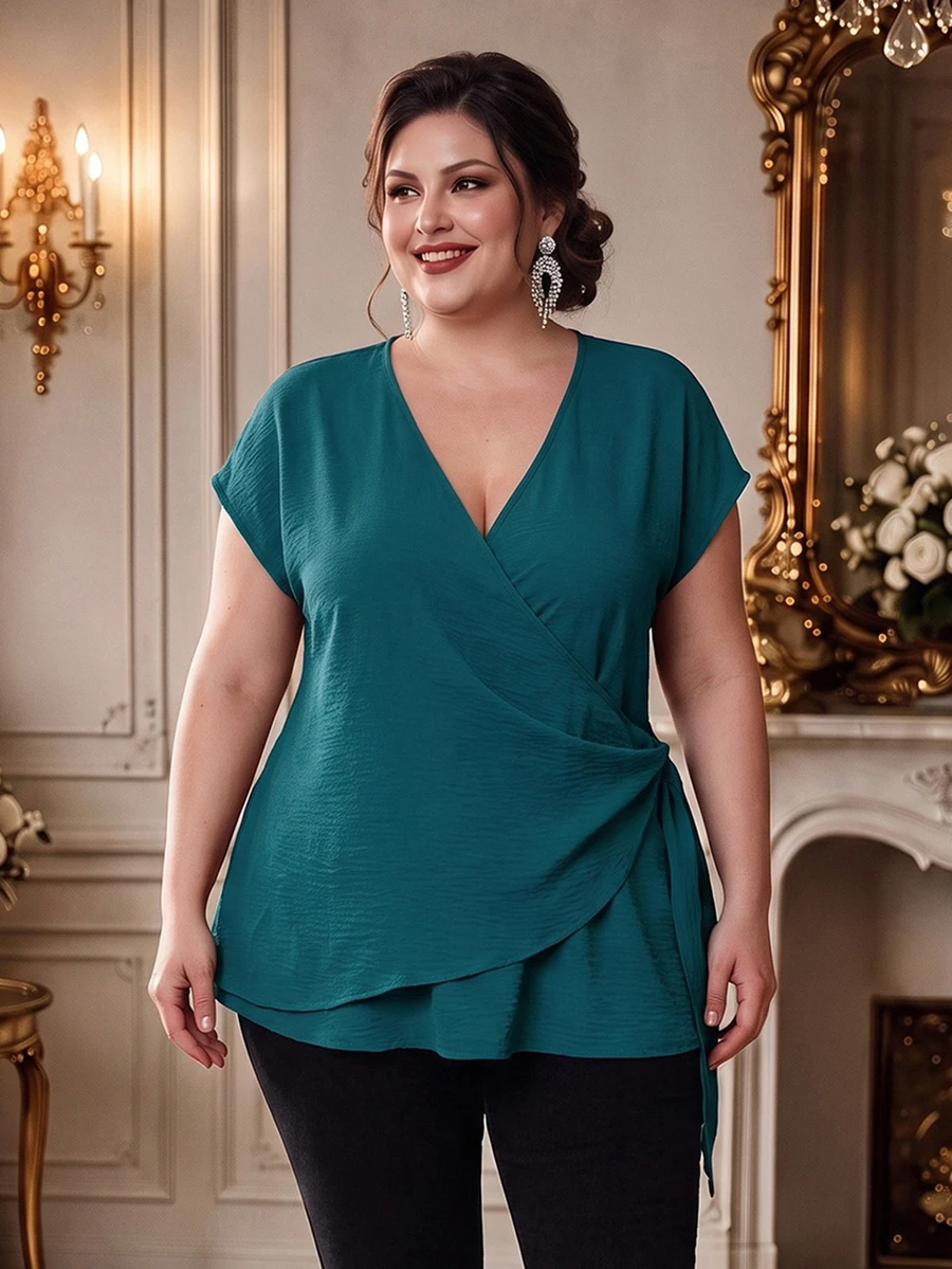 Rometta Plus Size Peacock Blue Deep V-Neck Ruched Textured Fabric Cross Wrap Side Tie Short Sleeve Asymmetrical Hem Cinched Waist Casual Commuter Versatile Blouse - Blue - View 1