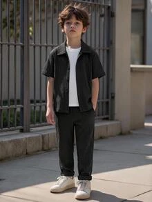 SHEIN Vacaura 2pcs Set Young Boy Solid Color Short Sleeve Button-Down Shirt And Pants, For Getaway, Holiday, Travel, Relax, Sunbathing, Summer - Black - View 1