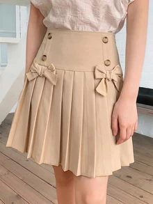 SHEIN BigGirls HighWaist PleatedSkort, SweetPreppy Skort WithBows & Decor Buttons, Built-In Anti-Chafing Liner, Great For FallWinter, School&Holiday Outfits - Khaki - View 1