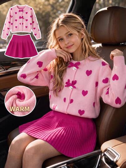 SHEIN Conjunto de suéter de punto con lazo en forma de corazón de manga larga y falda negra para niñas, moda de otoño/invierno