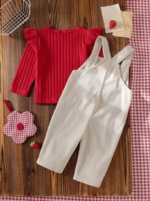 SHEIN 2 قطعة تي شيرت وبنطلون أوفرول من الكوردروي مع جيب للبنات الصغيرات، تصميم لطيف وحلو باللون الأحمر والكريمي بنقشة الفراولة مع كشكشة وأكمام طويلة متموجة، مناسب للخارج والحفلات في الخريف والشتاء - الأحمر - مشاهدة 2