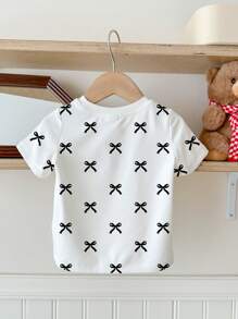 SHEIN Kleine Mädchen süß niedlich Schleife Muster lässiges minimalistisches Rundhals Kurzarm T-Shirt, geeignet für den Sommer
