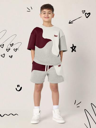 طقم رياضي للأولاد من قطعتين شورت قصير وبلوزة بنمط...