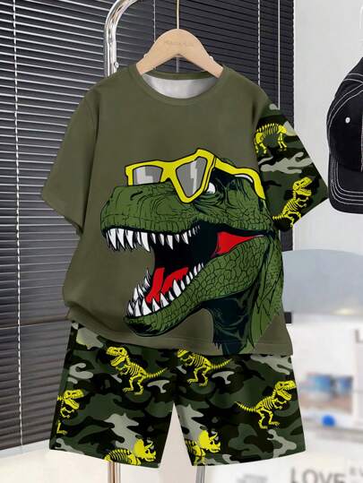 SHEIN Conjunto casual de 2 piezas de niño preadolescente con camiseta de manga corta con estampado de dinosaurio de dibujos animados y pantalones cortos, adecuado para el verano