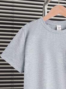 SHEIN Set da 2 pezzi per ragazzo adolescente, composto da maglietta a maniche corte con scollo tondo e pantaloncini a righe, in stile casual estivo, pigiama allentato