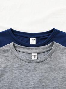 SHEIN Set de 2 piezas de pijama para niños preadolescentes con camiseta de cuello redondo de manga corta y estampado liso y pantalón corto suelto a cuadros