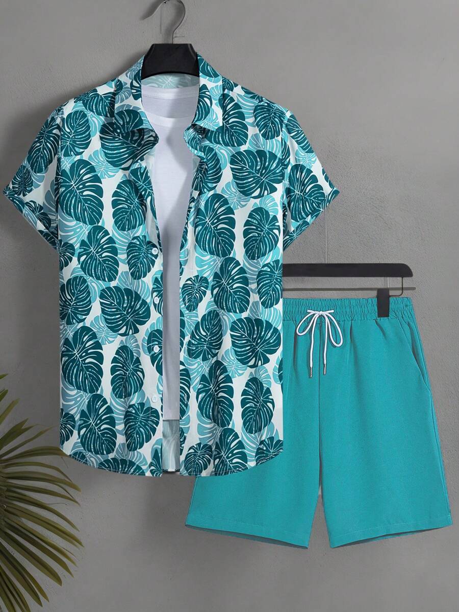 Manfinity Swimmode Bộ đồ thường ngày cho kỳ nghỉ nhiệt đới dành cho nam: Áo sơ mi tay ngắn in họa tiết lá thời trang và quần short kết hợp chiều dài thông thường hoàn hảo cho bãi biển, Hawaii - Màu xanh Cadet - Xem 1