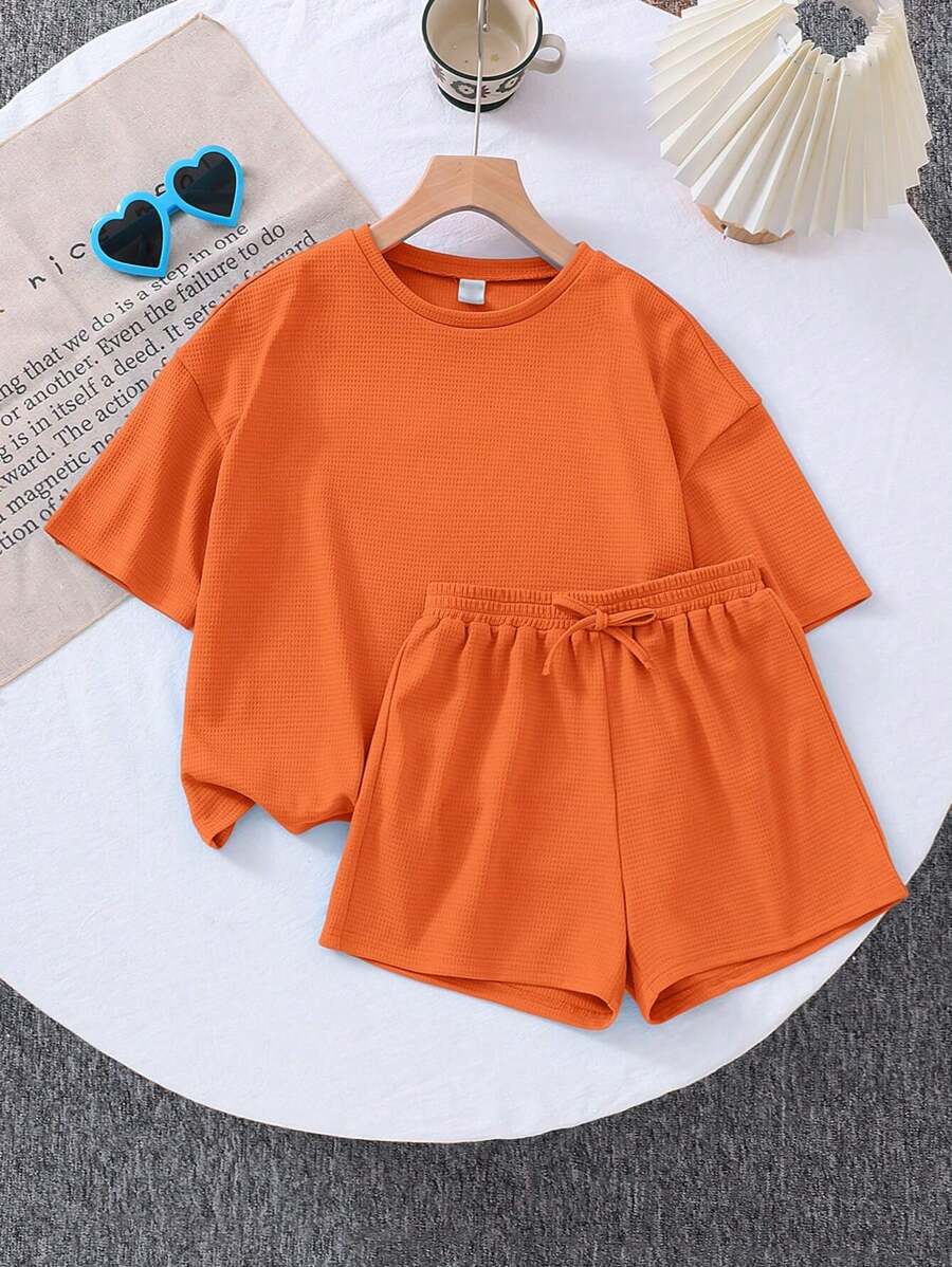 SHEIN LMoss Kids 2pcs Set: Young Girl Solid Color Loose Knit Crew Neck T-Shirt And Fitted Knit Shorts - Orange - View 1