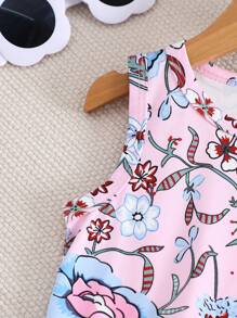 Tenue pour bébé fille, Top à col rond avec imprimé fleuri et franges, assorti à un short. Tenue polyvalente et décontractée, adaptée pour le port quotidien.