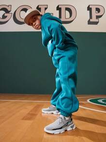 Chaussures de sport grises souples et respirantes en maille, polyvalentes et casual, parfaites pour la rentrée scolaire