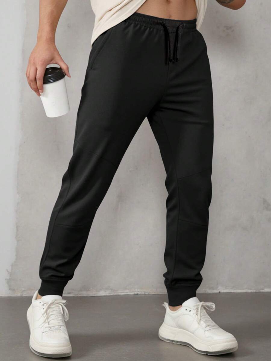 SHEIN Pantalones de chándal sólidos cómodos y casuales para adolescentes varones