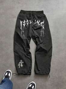 Manfinity Sport Corelite Pantalones deportivos casuales sueltos con cordón en la cintura y estampado de cruz para hombres