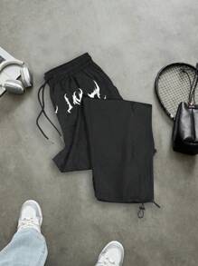 Manfinity Sport Corelite Pantalones deportivos casuales sueltos con cordón en la cintura y estampado de cruz para hombres