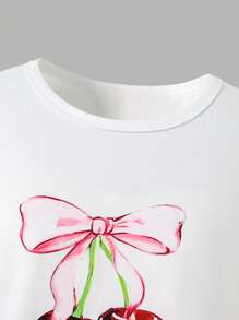 Conjunto de 2 piezas para niñas pre-adolescentes con blusa de cuello redondo de manga corta con estampado de cerezas y pantalones cargo en rojo y blanco