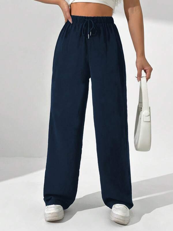 Flirla Pantalones casuales de pierna recta con lazo delantero de color liso para mujer