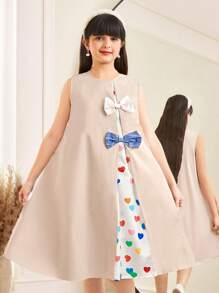 SHEIN Vestido holgado informal y minimalista cómodo para niña preadolescente, con cuello redondo, manga abultada, parches y decoración de moño - Albaricoque - Ver 1
