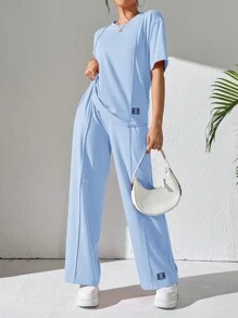 Mulvari Women's Casual Two-Piece Outfit: Knitted Fabric, Short Sleeve Round Neck Top And Long Patched Pants In Sky Blue - Blue - View 1