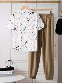 SHEIN Conjunto de 2 piezas de ropa informal para chicos adolescentes: camiseta de manga corta con estampado gráfico de salpicadura blanca y pantalón de chándal negro - Caqui - Ver 2