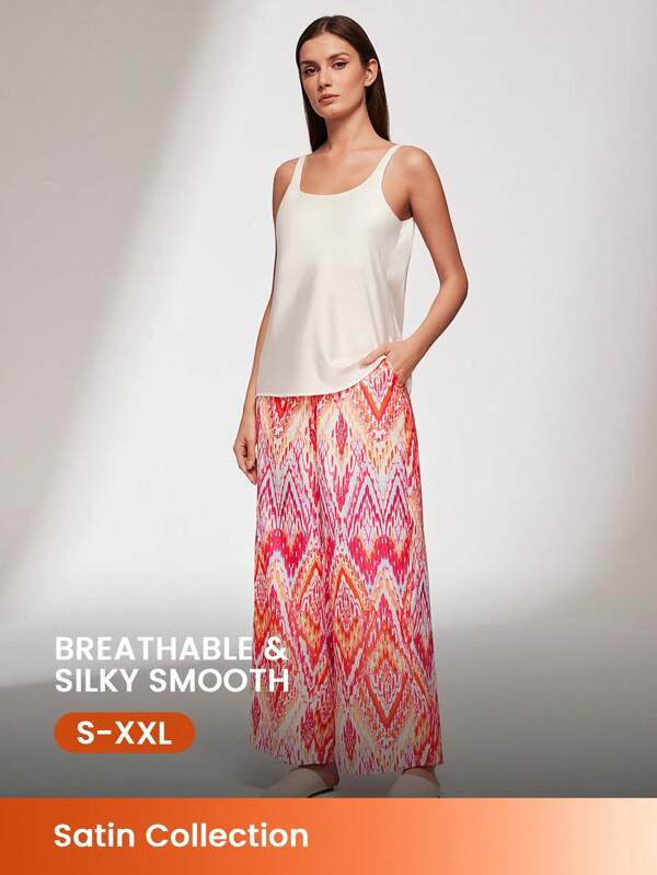 LUVLETTE Conjunto de lencería para uso exterior compuesto por top de tirantes de satén rosa básico y pantalones estampados. Conjunto de pijama ligero con bolsillos en los pantalones para mujeres.