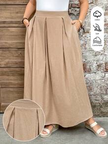 SHEIN LUNE تنورة بوهيمية بجيوب مطوية وشق، متعددة الاستخدامات بلون أحادي، مناسبة للمناسبات الكاجوال مثل عيد الفصح والحفلات الريفية والتخرج والصيف والغداء في عيد الأم والكنيسة، مقاسات كبيرة - لون مشمشي - مشاهدة 1