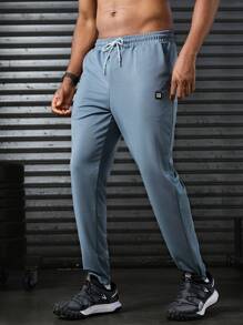 Manfinity Sport Corelite Men's Letter Printed Drawstring Waist Pocket Sports Pants Workout Clothes Running Pants